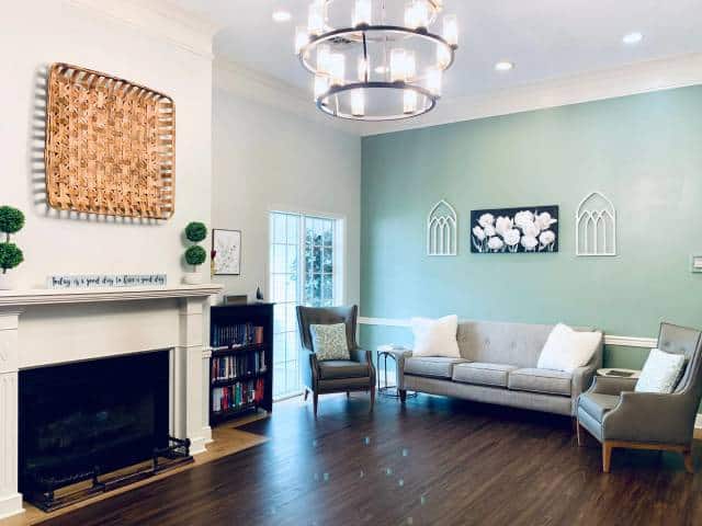living room featuring a fireplace and comfortable couches